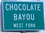 Photo of the Chocolate Bayou sign on Highway 288 near Houston, Texas.