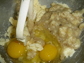 Eggs and mashed banana is added to whipped margarine mixture.