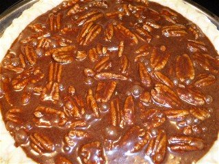 Chocolate pecan pie ready for the oven.
